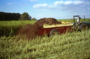 Truck spreading fertilizer